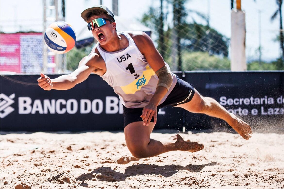 Miles Partain diving for the dig on the beach